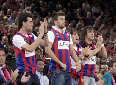 The Barcelona footballers cheer on their basketballing counterparts in 2010.