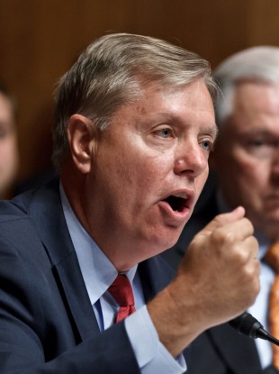 Republican senator Lindsey Graham (left) believes the Obama administration has played down details of a co-ordinated attack on a consulate in Libya last month.