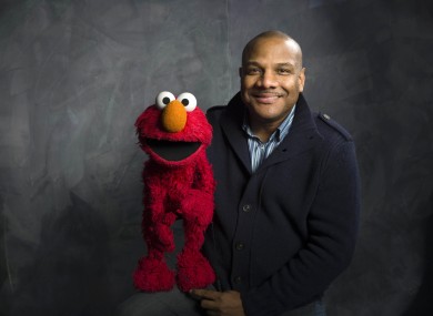 Kevin Clash and Elmo pictured in 2011
