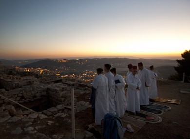 Members of the ancient Samaritan community, pray during the pilgrimage for the holy day of the Tabernacles or Sukkot