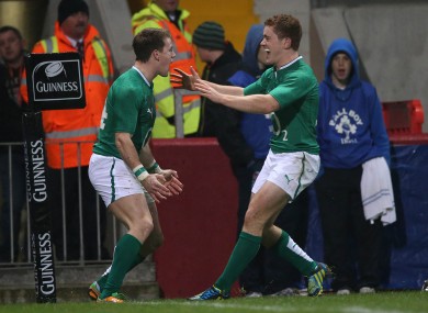 The duo celebrate after a Gilroy try for Ireland.