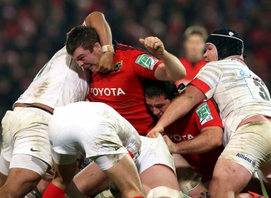 Peter O'Mahony gets to grips with the Saracens pack.