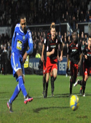 Macclesfield Town's Matthew Barnes-Homer scores their winner in the third round.