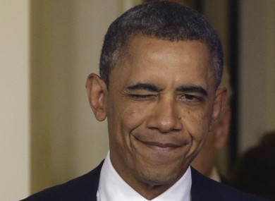 President Barack Obama winks as he arrives to make a statement regarding the passage of the fiscal cliff bill.