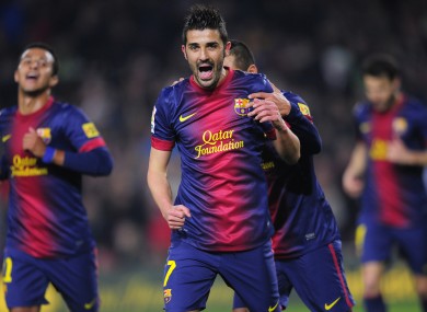 Villa celebrates one of his goals.