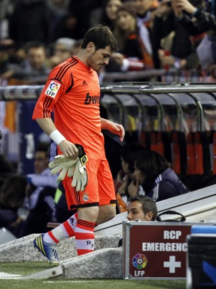 Real Madrid's goalkeeper Iker Casillas leaves the field injured during their a Copa del Rey soccer match against Valencia.