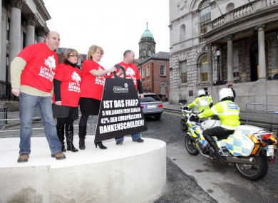 ICTU protestors complain about the nationalisation of banking debts. Unions are holding simultaneous 'not our debt' marches in six towns today.