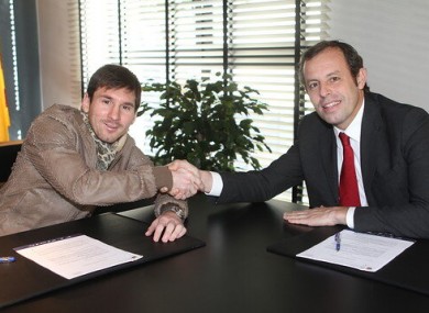 Messi and Barca president Sandro Rosell.