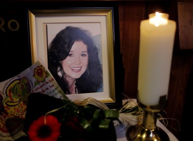 A candle burns during a Memorial Mass for murdered Irish woman Jill Meagher (seen in framed photo) at St Peter's Church, Drogheda, Co Louth (file photo).