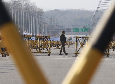 A South Korean army soldier patrols at Unification Bridge, which leads to the demilitarised zone separating North and South Korea.