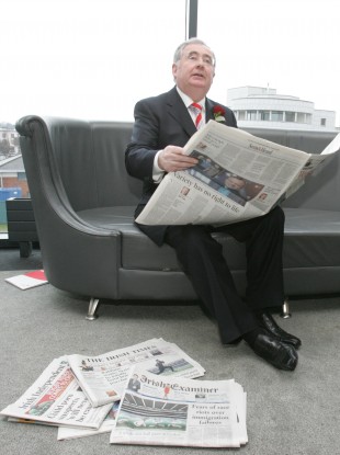 Pat Rabbitte reading newspapers at Labour's annual conference in 2007. Rabbitte says the public service broadcasting charge cannot be expected to try and save other forms of media.