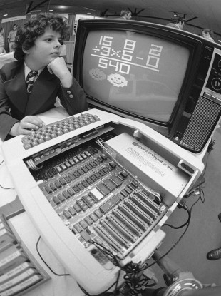 Jeff Leff, 9, from Toronto at the Boston Computer show in August 1977. He is trying out one of Apple's first computer.