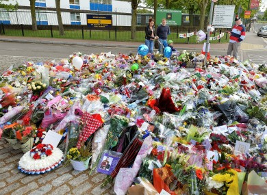 Floral tributes outside the main gate of the Royal Artillery Barracks in Woolwich, south-east London, near to the spot where Drummer Lee Rigby was hacked to death on Wednesday.
