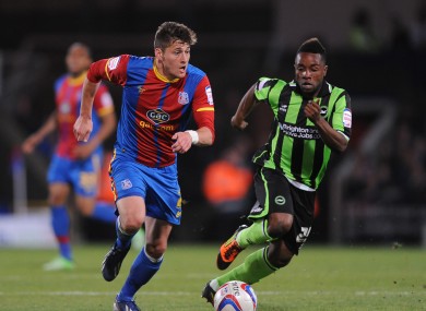 Crystal Palace's Joel Ward (left) and Brighton and Hove Albion's Kazenga LuaLua (right) battle for the ball.