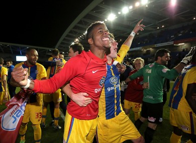Crystal Palace's Wilfried Zaha (left) celebrates with his team-mate Joel Ward after the final whistle.