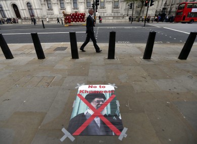 A poster with a photo of Ayatollah Ali Khamenei, Iran's Supreme Leader, placed by Iranian activists protesting against their government in London on Wednesday