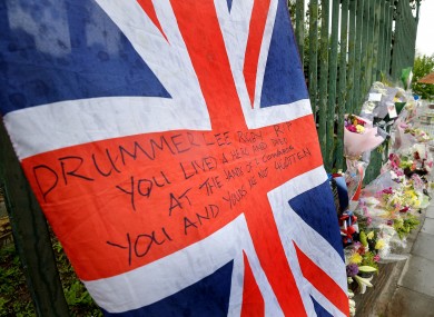The scene at the junction of Artillery Place and John Wilson Street which has become a shrine to Drummer Lee Rigby, who was murdered on Tuesday afternoon.