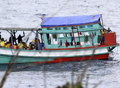 Photo taken on 14 April, shows a fishing boat carrying Vietnamese asylum seekers near the shore of Australia's Christmas Island.