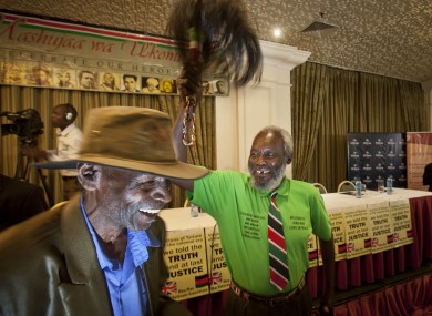 Mau-Mau veteran Mathenge Iregi, 81, waves a a ceremonial whisk to celebrate William Hague's announcement.