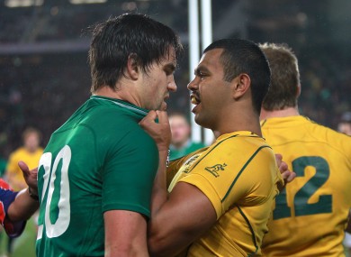Kurtley Beale (right) has a polite disagreement with Ireland's Conor Murray.