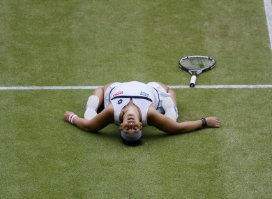 France's Marion Bartoli celebrates defeating Belgium's Kirsten Flipkens.