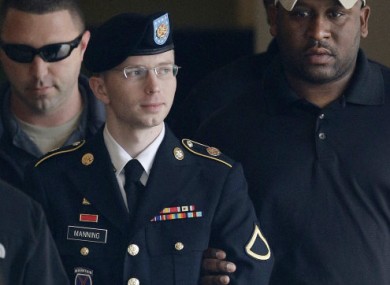 Army private Bradley Manning is escorted into a courthouse in Fort Meade Maryland yesterday.