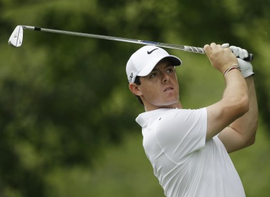 Rory McIlroy hits on the 15th hole during a practice round for the PGA Championship golf tournament at Oak Hill Country Club.