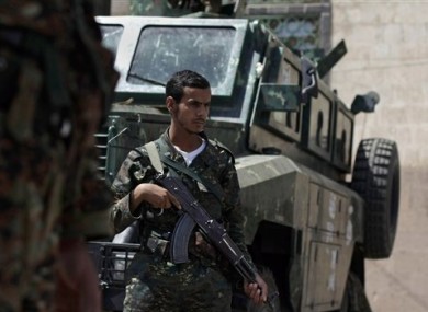 Yemeni soldiers man a checkpoint on a street leading to the U.S. and British embassies in Sanaa, Yemen.