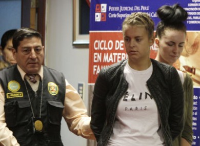 Melissa Reid is led to court in Peru last month.