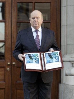 Michael Noonan with his Budget document last year