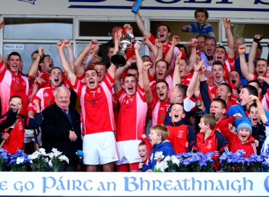 Passage joint captains Eoin Kelly and Conor Carey lift the cup.