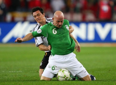 Lee Carsley tries a unique ball-shielding tactic against Piotr Trochowski of Germany in 2007.