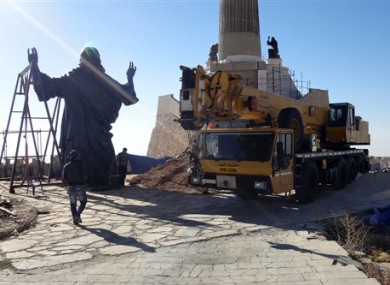 Giant bronze statue of Jesus under construction.