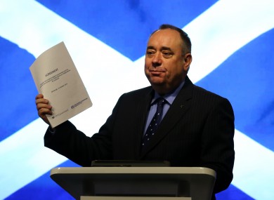 Alex Salmond holds a copy of the Scottish-UK agreement to hold a referendum, in this October 2012 photo