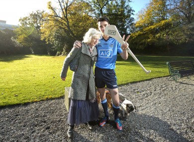 Dublin hurler Danny Sutcliffe meets a local lady walking her dogs.