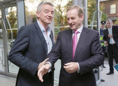 Who's hand is Enda reaching for?