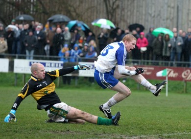 Collie Devlin scores past Kerry Gaels goalkeeper Shaun Howard.