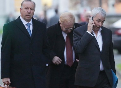 Director at CRC, David Martin (left) Chairman of the CRC James Nugent (centre behind) and Former CEO Paul Kiely (right) leave Leinster House following their meeting with the PAC.