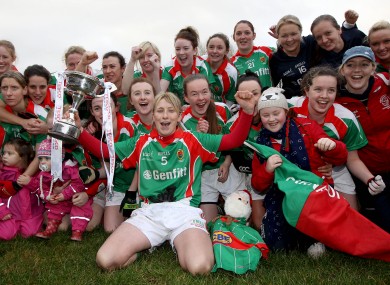 Carnacon's Marie Corbett celebrates with the trophy.