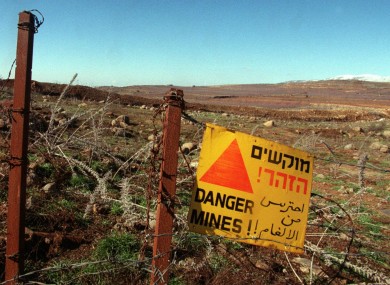 A sign warning of the danger of landmines in the Golan Heights.