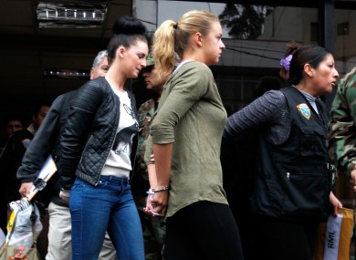 Michaela McCollum Connolly and Melissa Reid being escorted to a court appearance in August