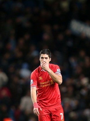 Liverpool's Luis Suarez shows his dejection after the final whistle against City.