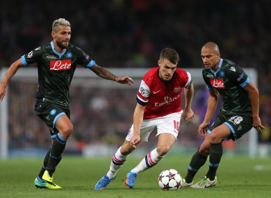 Aaron Ramsey goes by Gokhan Inler and Valon Behrami when Arsenal and Napoli met at the Emirates Stadium.