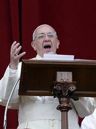 Pope Delivers his message from the central balcony of St. Peter's Basilica