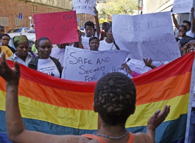 Women protest against a sentence of 14 years in prison, with hard labor, given to two men in Malawi under Malawi's anti-gay legislation.