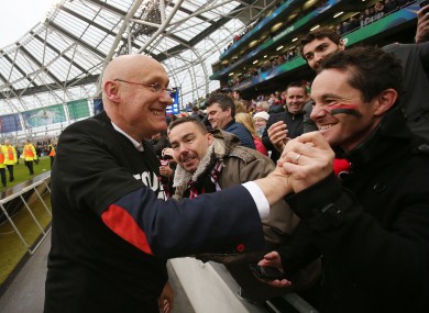Bernard Laporte celebrating with Toulon fans after last May's Heineken Cup final win.