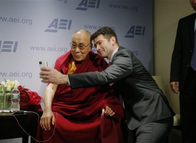 Tibetan spiritual leader the Dalai Lama poses for a
