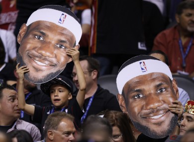 Miami Heat fans cheers on their favorite player, LeBron James.