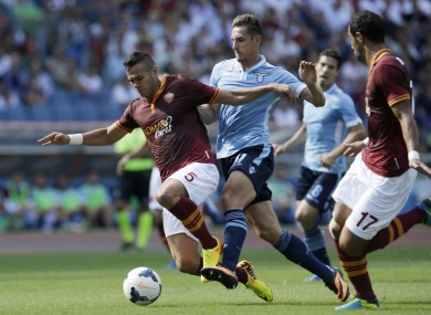 Roma defender Leandro Castan and Lazio striker Miroslav Klose.