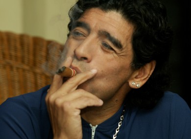 Former Argentine soccer player Diego Maradona speaks while he smokes a Cuban cigar with Javier Sotomayor (not in picture) in Havana, Cuba in 2005.